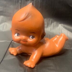Kewpie baby laying on belly Soft Plastic Brown Sweet Smile vintage collectible